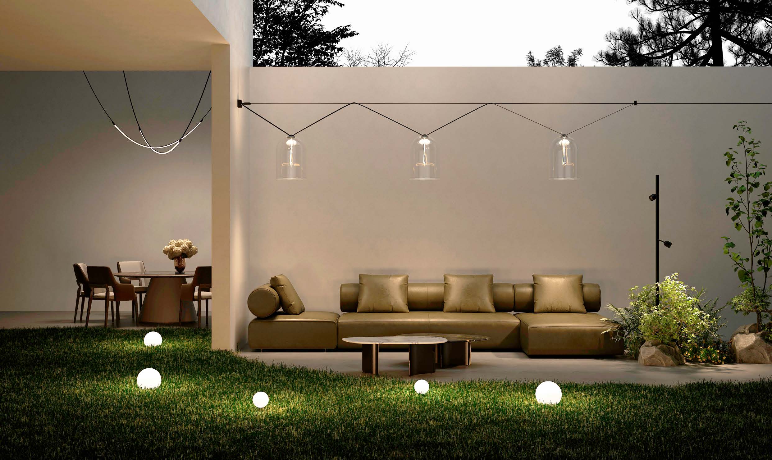 A patio lit at dusk by Leaves Lighting globes